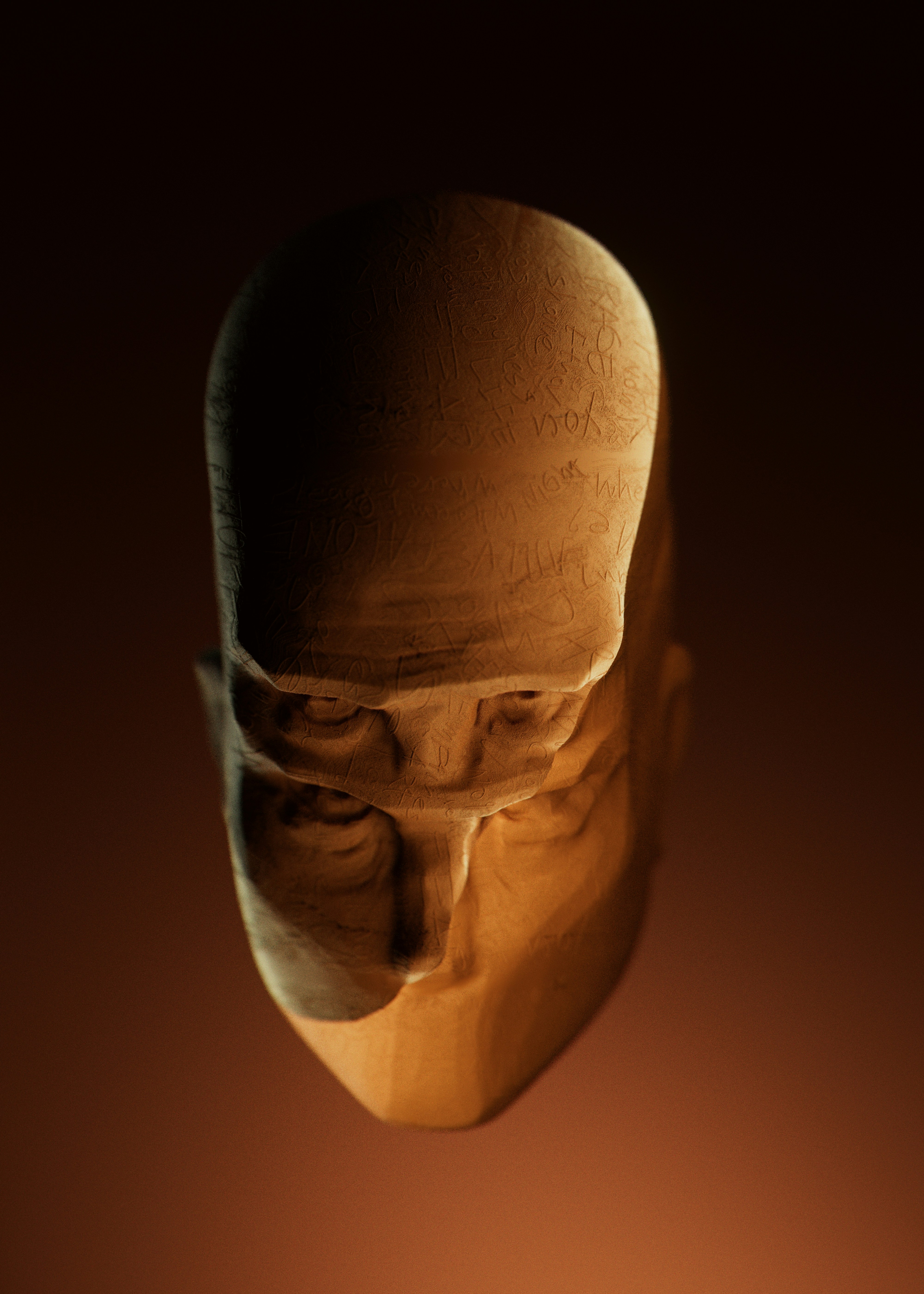 Wooden sculpture of a bald man's head