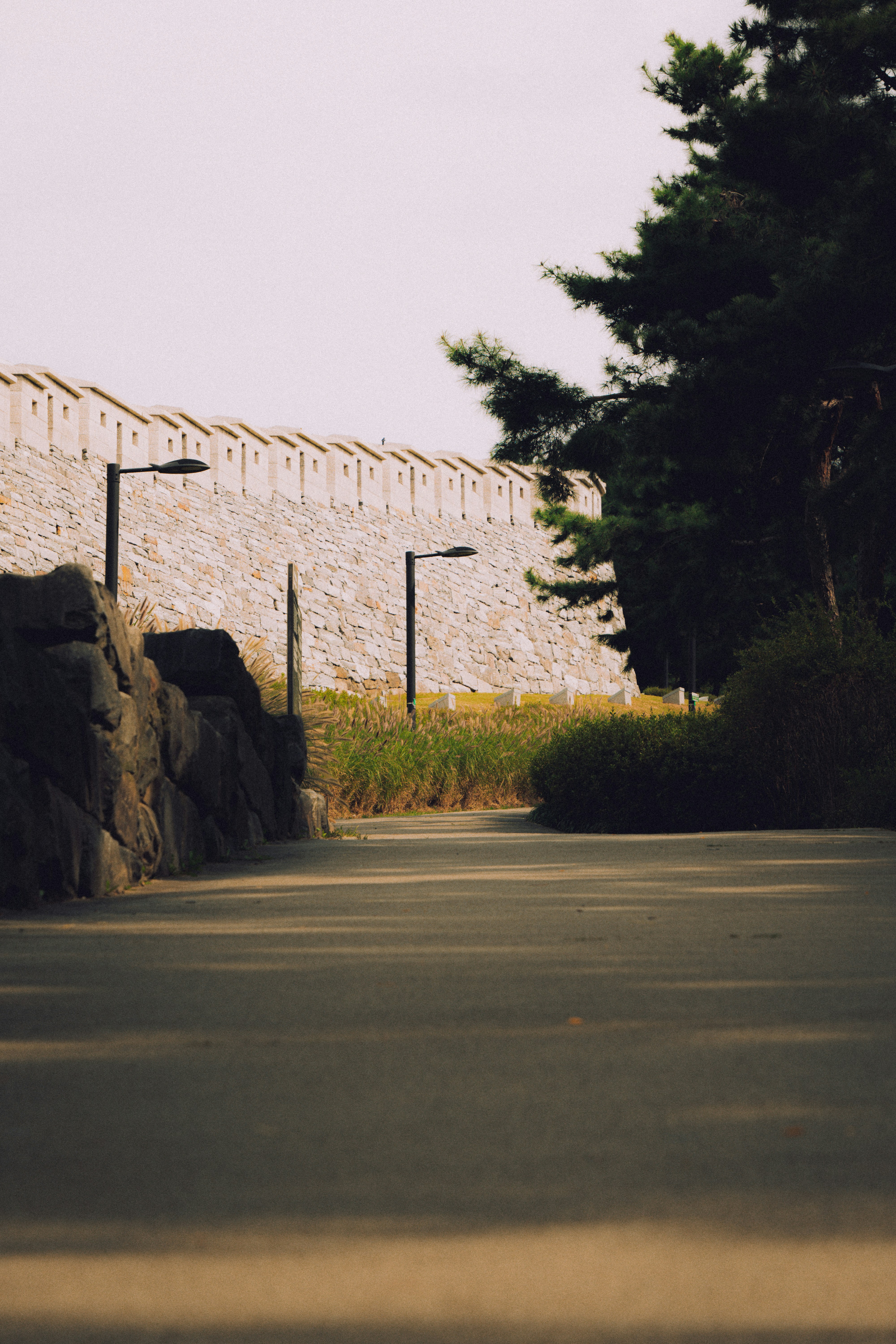 Stone wall and pathway in a park