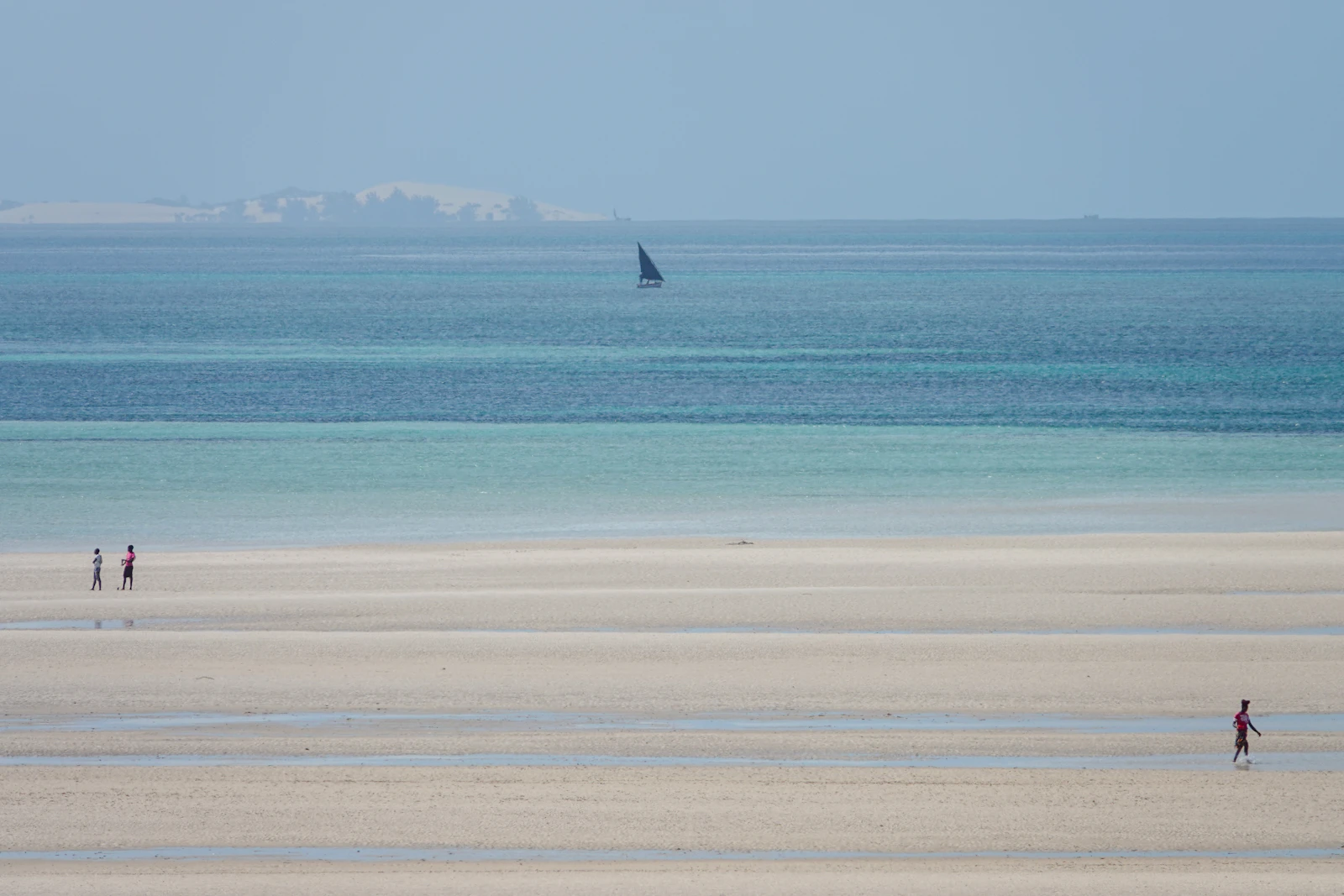 People walking on the coast near Vilanculos, Mozambique