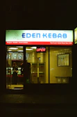 Eden kebab shop front at night with open sign