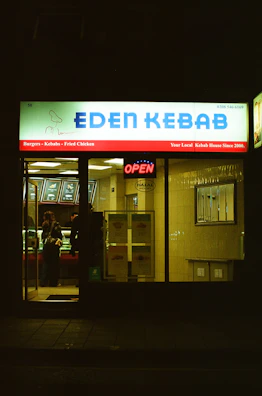 Eden kebab shop front at night with open sign