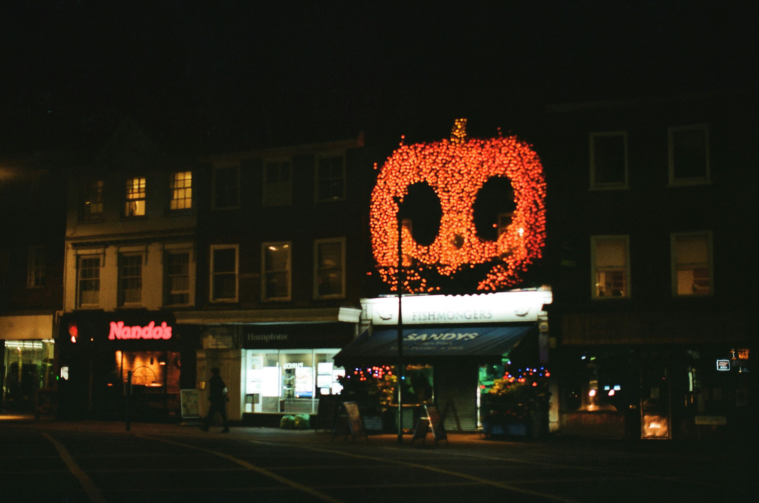 Night street with jack-o’-lanterns