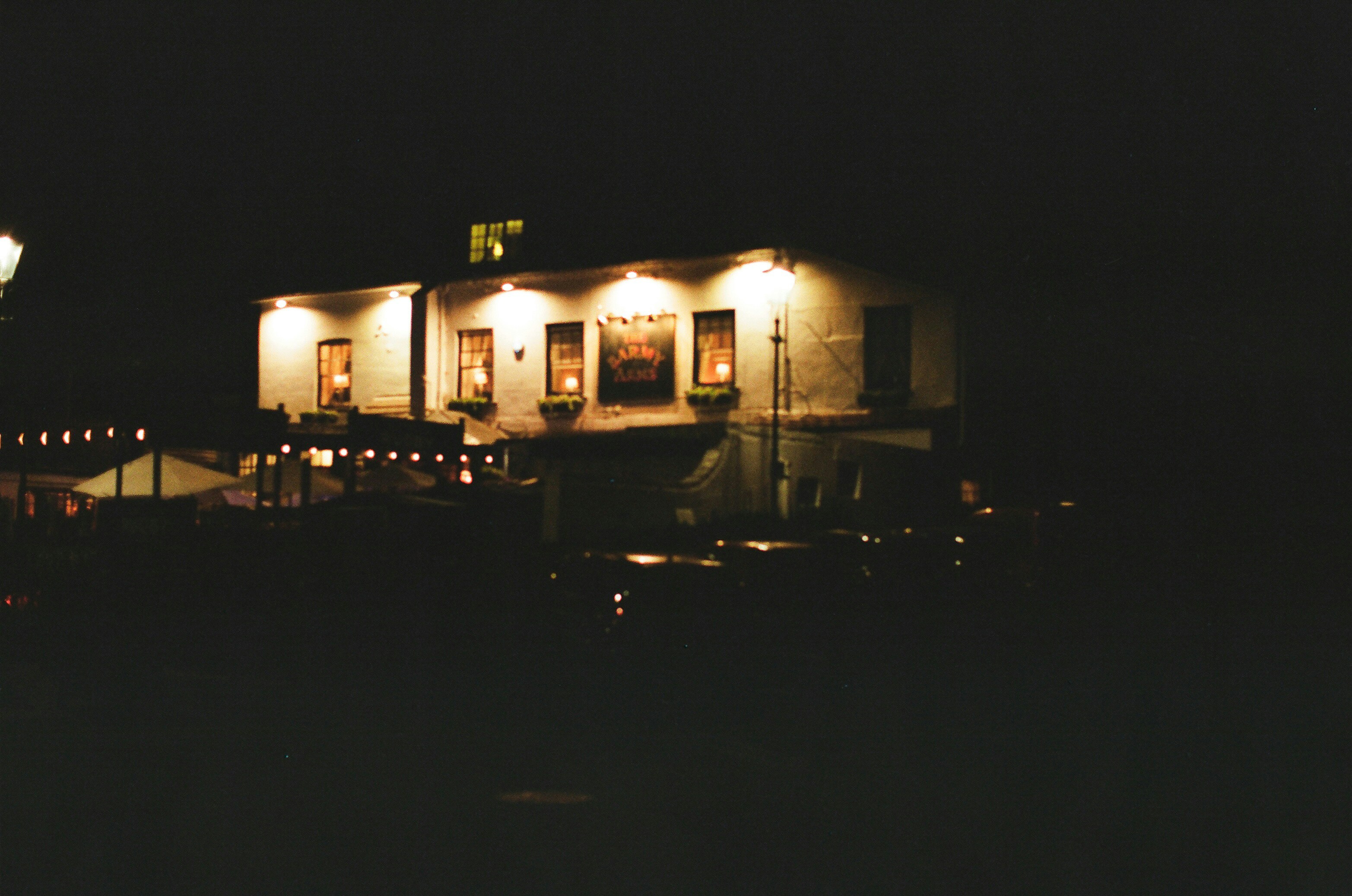 Building illuminated at night with outdoor lights