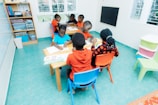 Children sitting at desks in a classroom