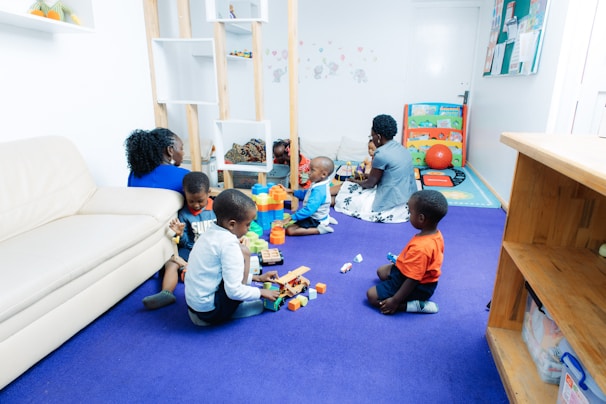Children playing with toys in a bright room.