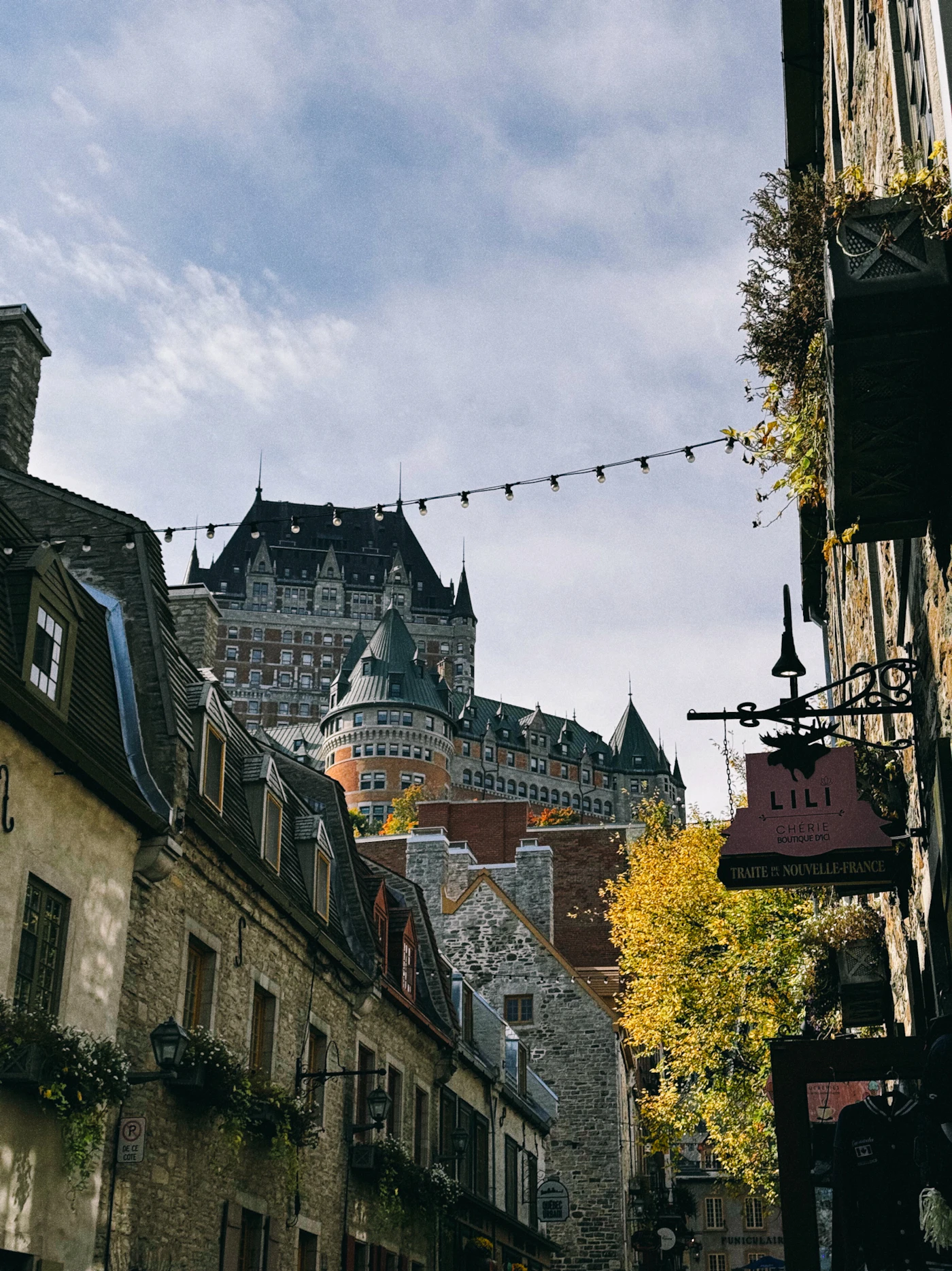 The Chateau Frontenac rising above the cobblestone streets of Old Quebec in autumn