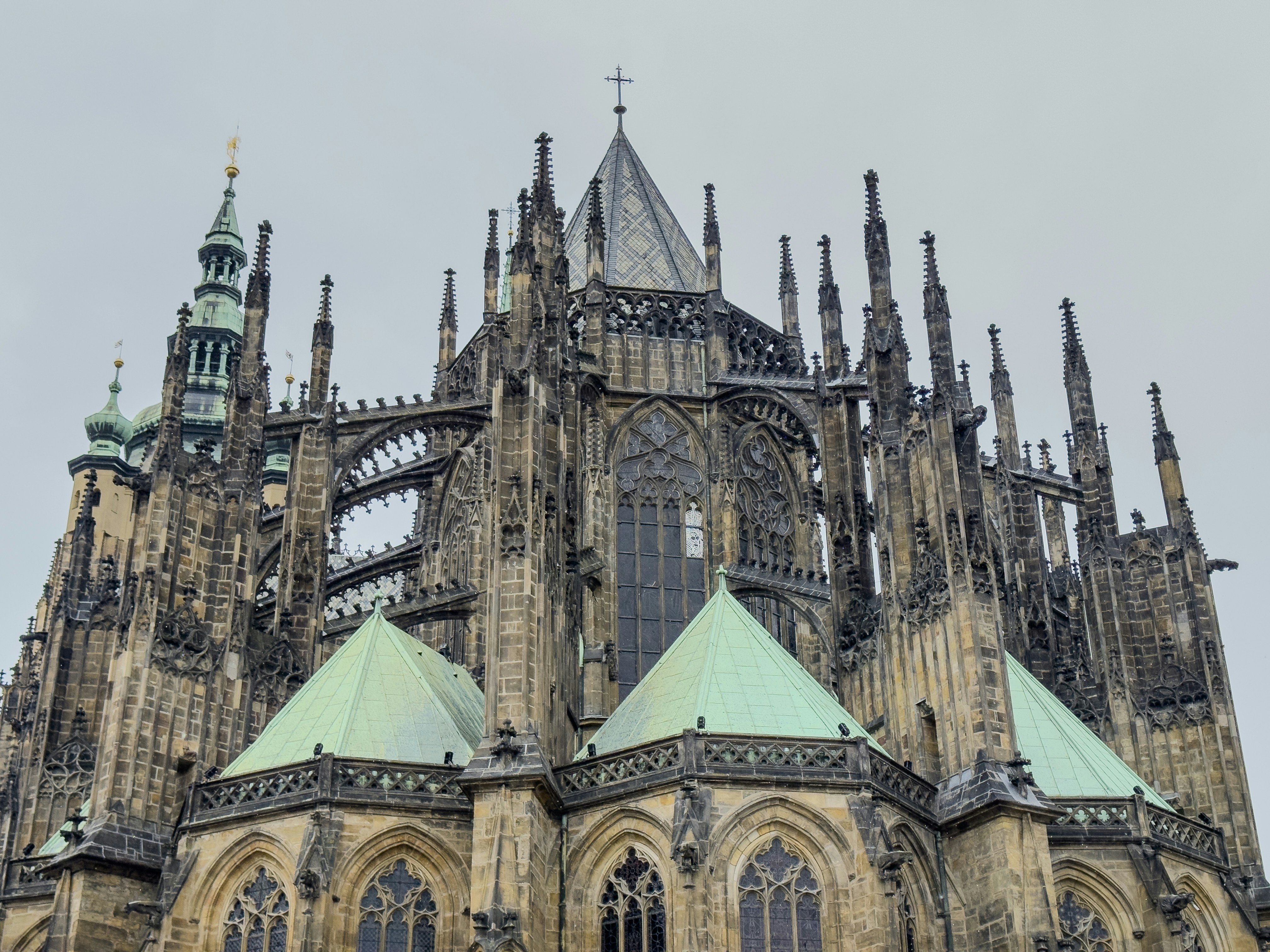 Gothic cathedral architecture with green roofs and spires