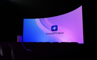 Large screen displaying "chatgpt atlas" logo