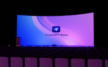 A large screen displays "chatgpt atlas" logo.