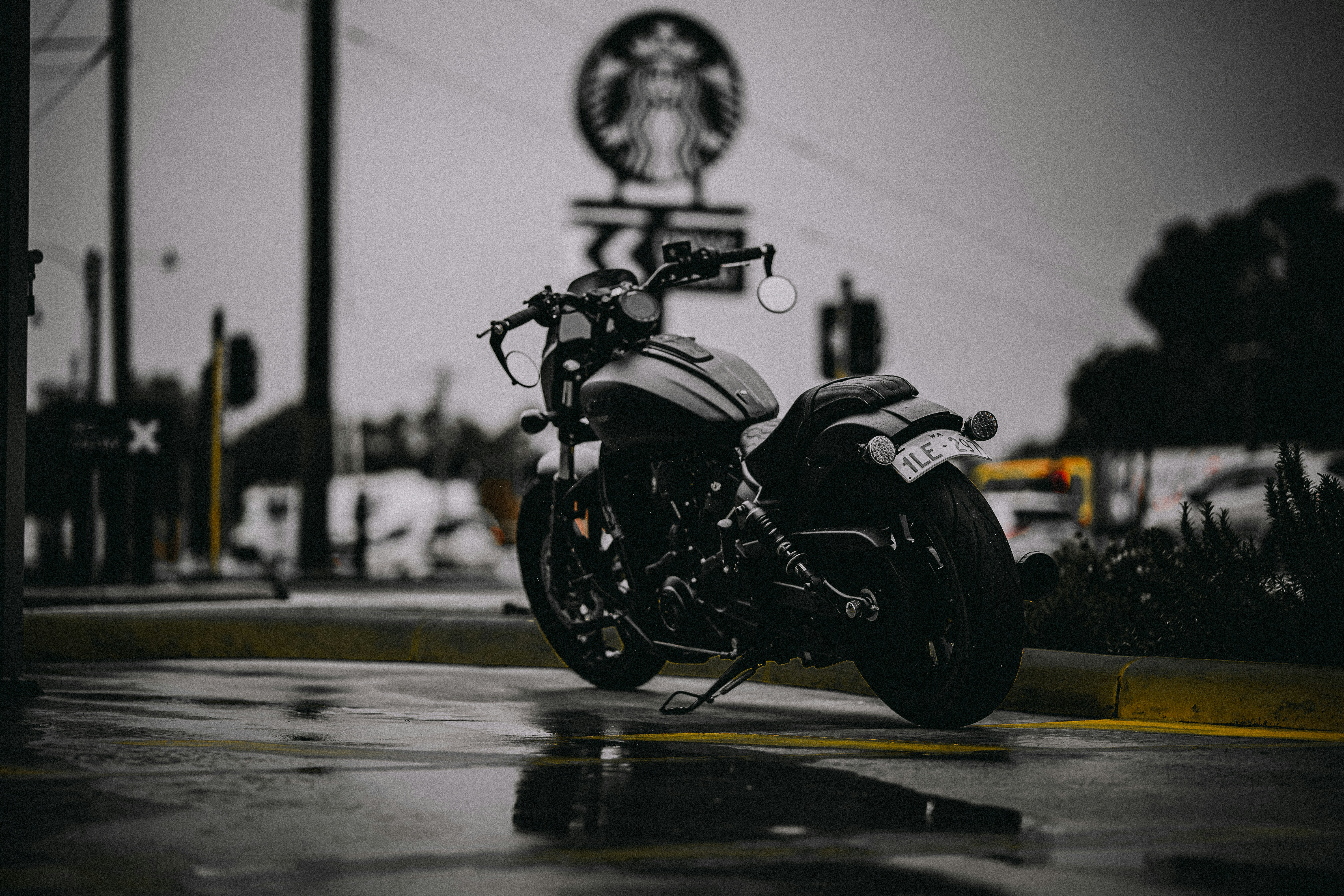 A parked motorcycle on a wet street