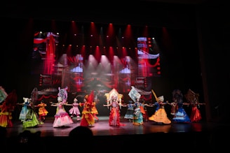 Performers in colorful costumes on a stage