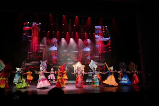 Performers in colorful costumes on a stage