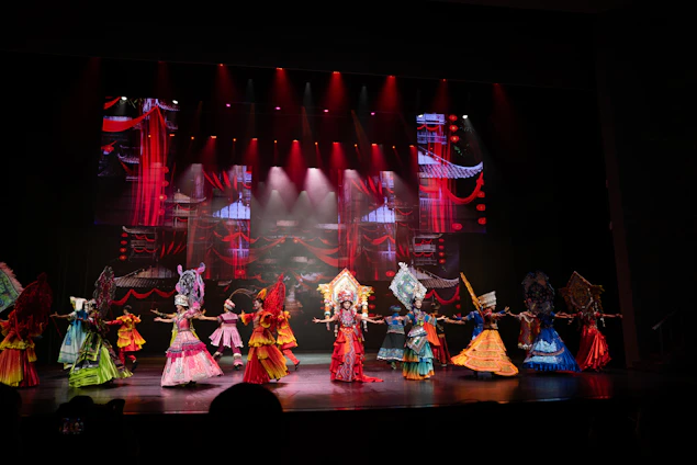 Performers in colorful costumes on a stage