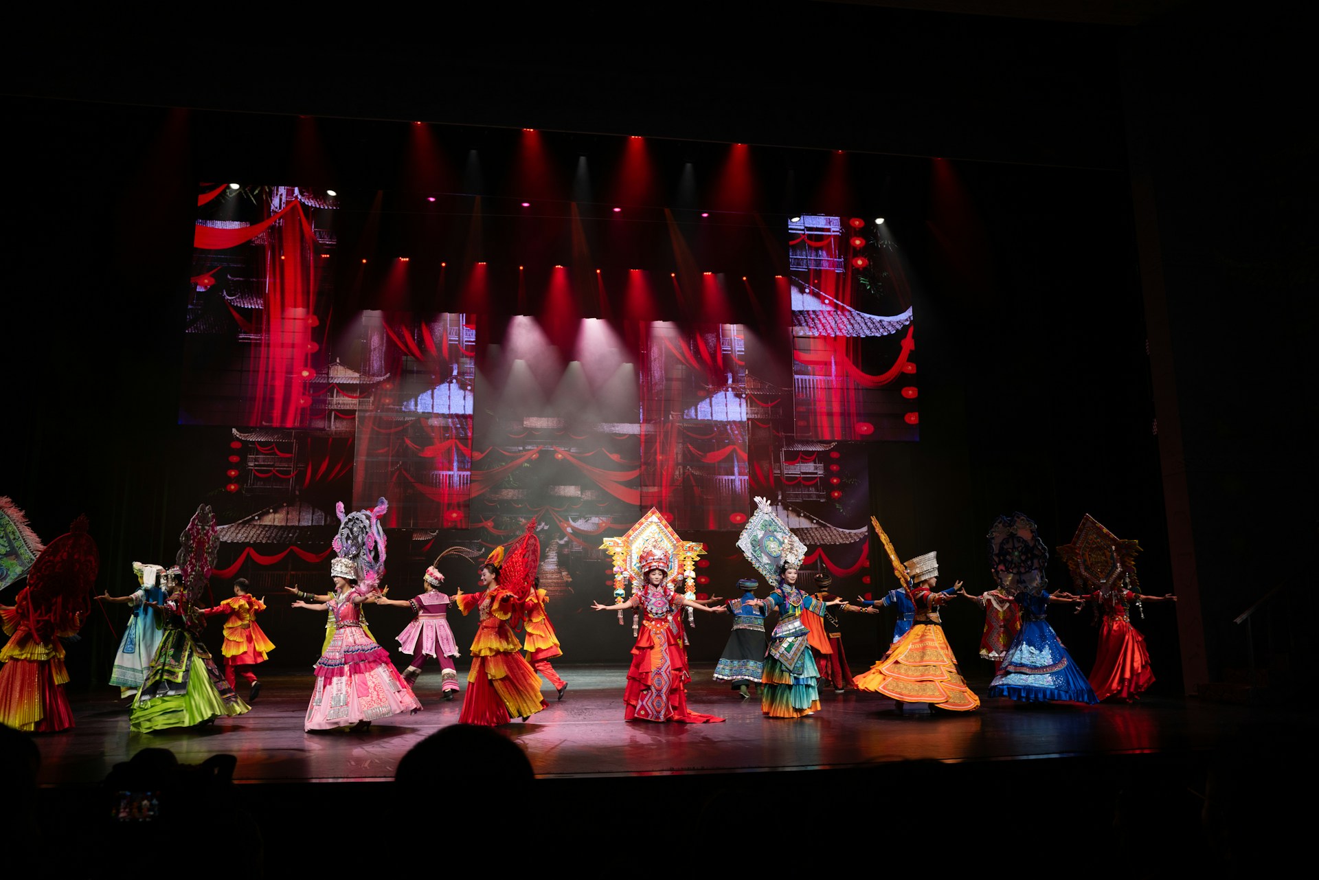 Performers in colorful costumes on a stage