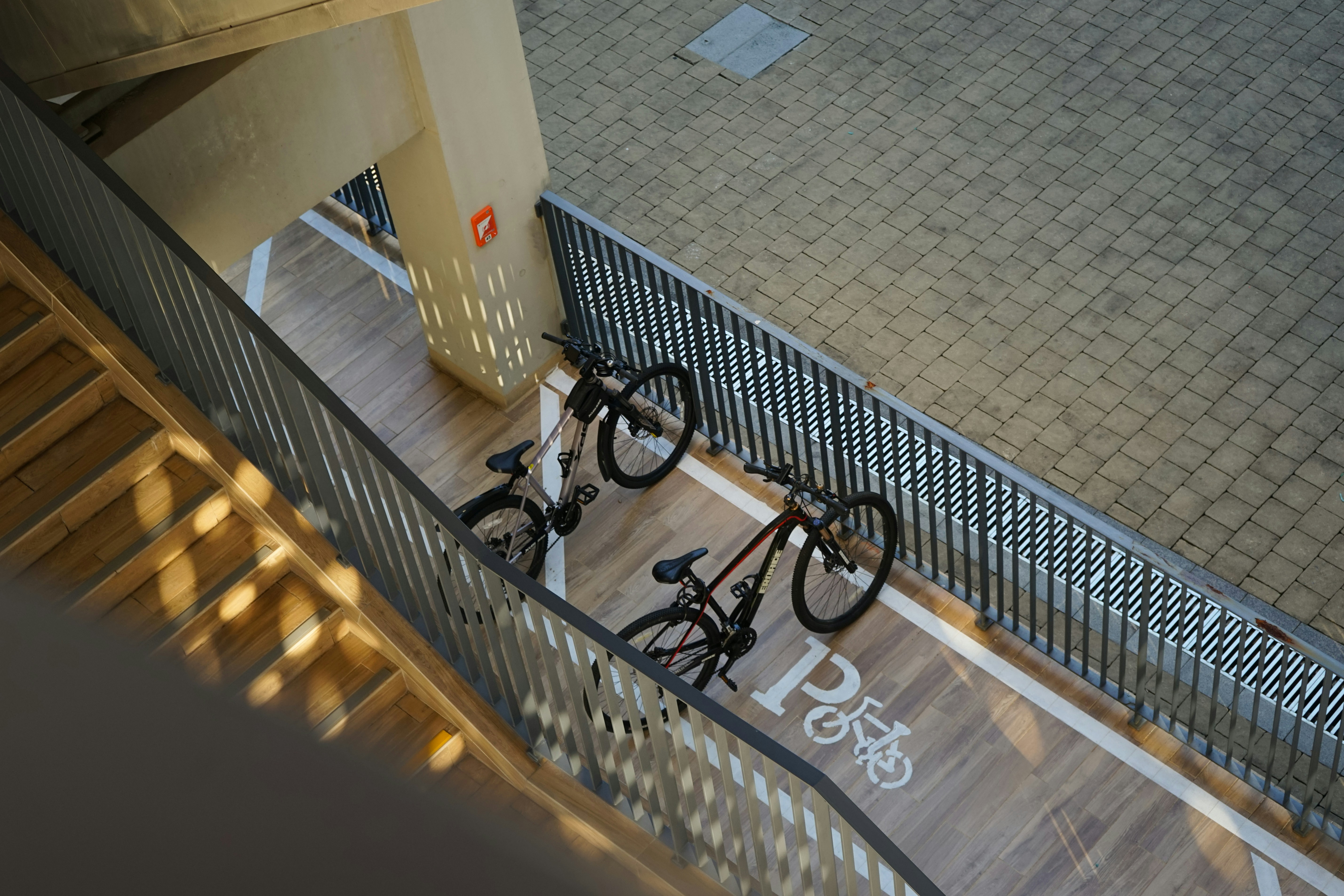 Two bicycles parked in designated area
