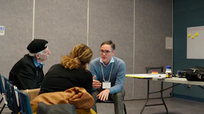 Three people talking in a casual meeting