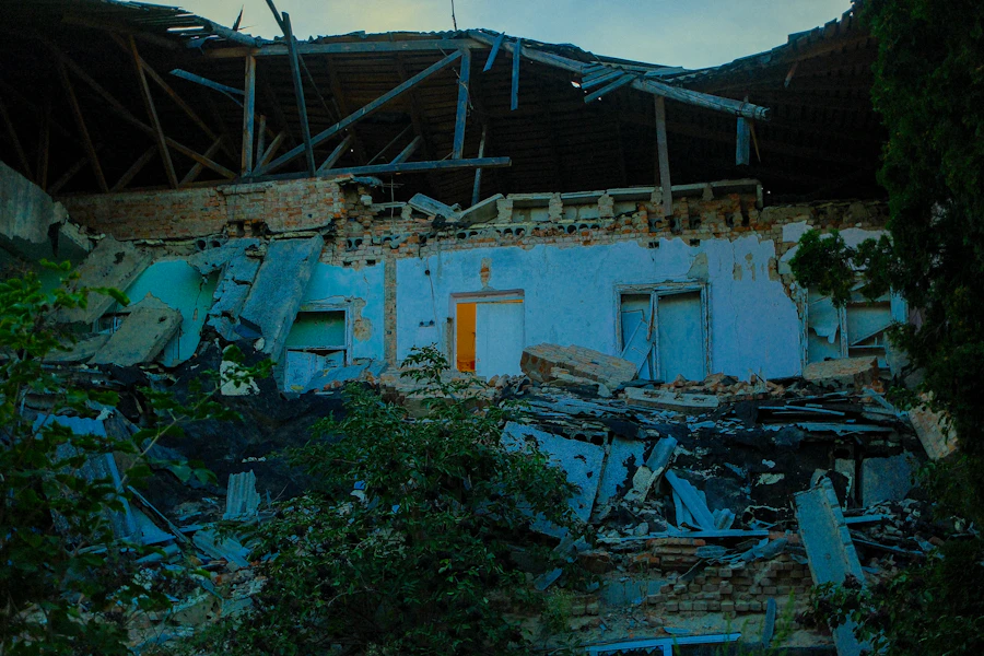 A destroyed building with exposed structure and rubble