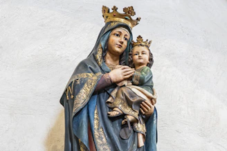 Statue of madonna and child with crowns