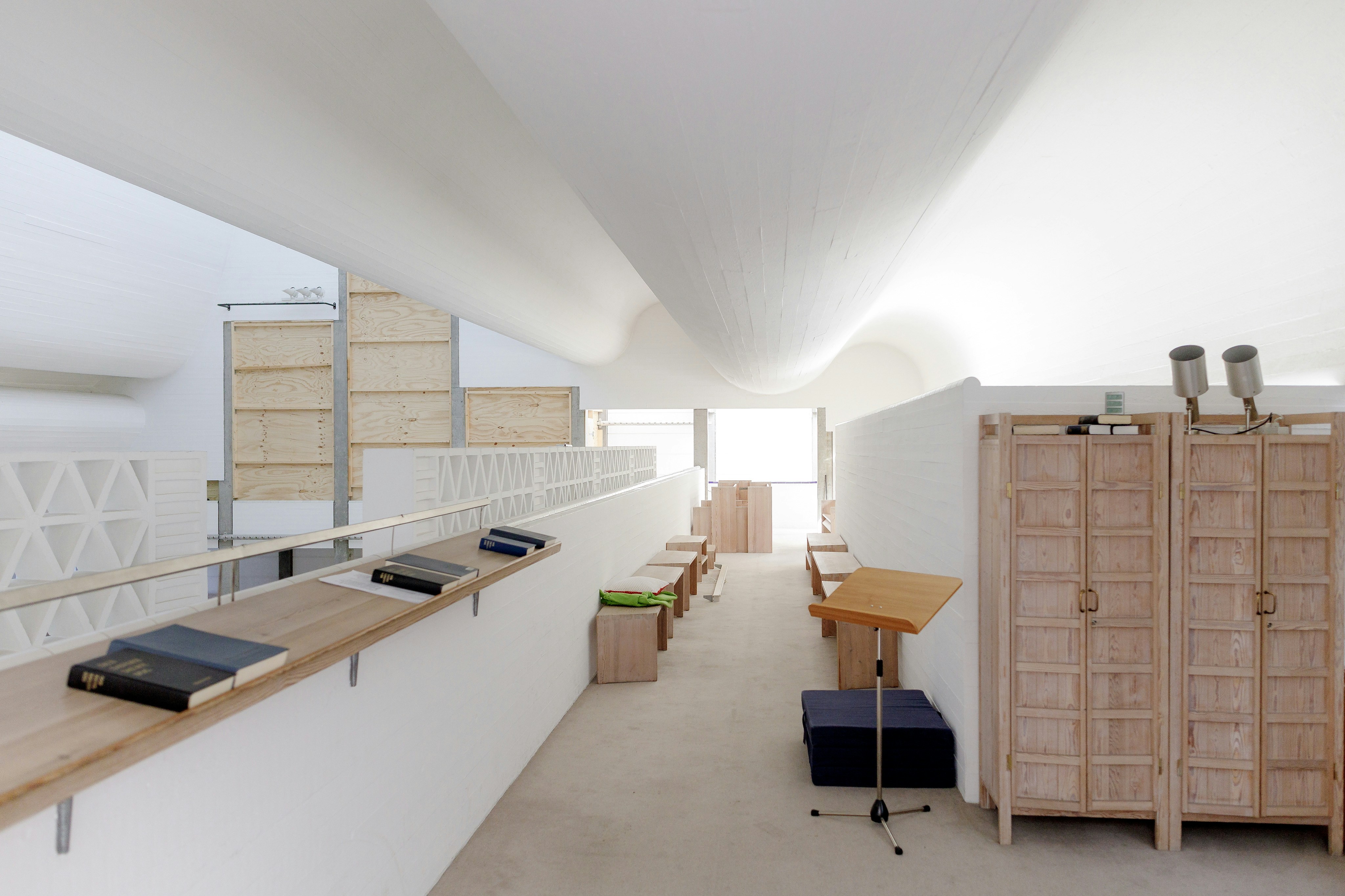 Modern interior with white walls and wooden accents.