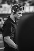 Man wearing headset on a football field