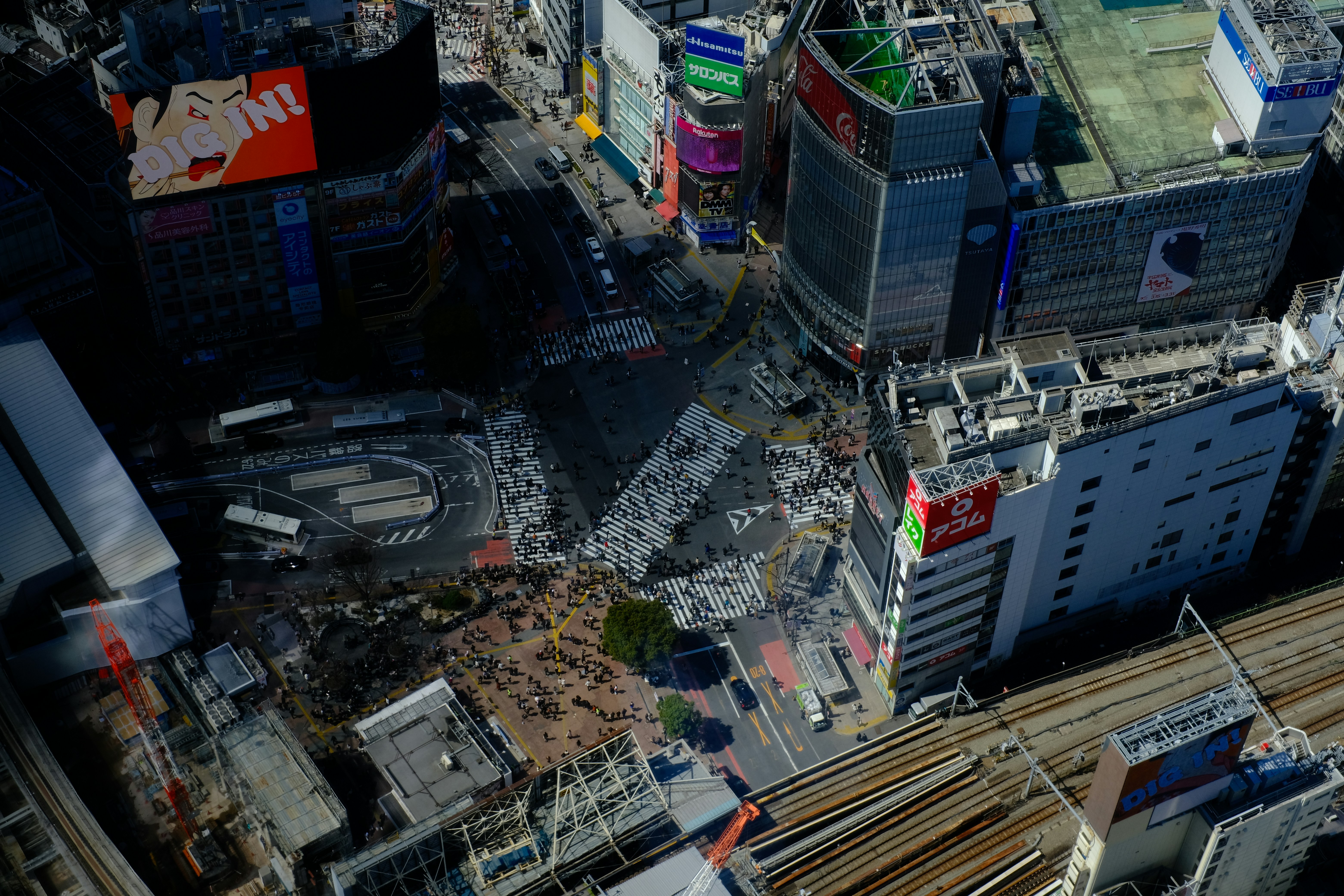 Aerial view of a busy city intersection with buildings.