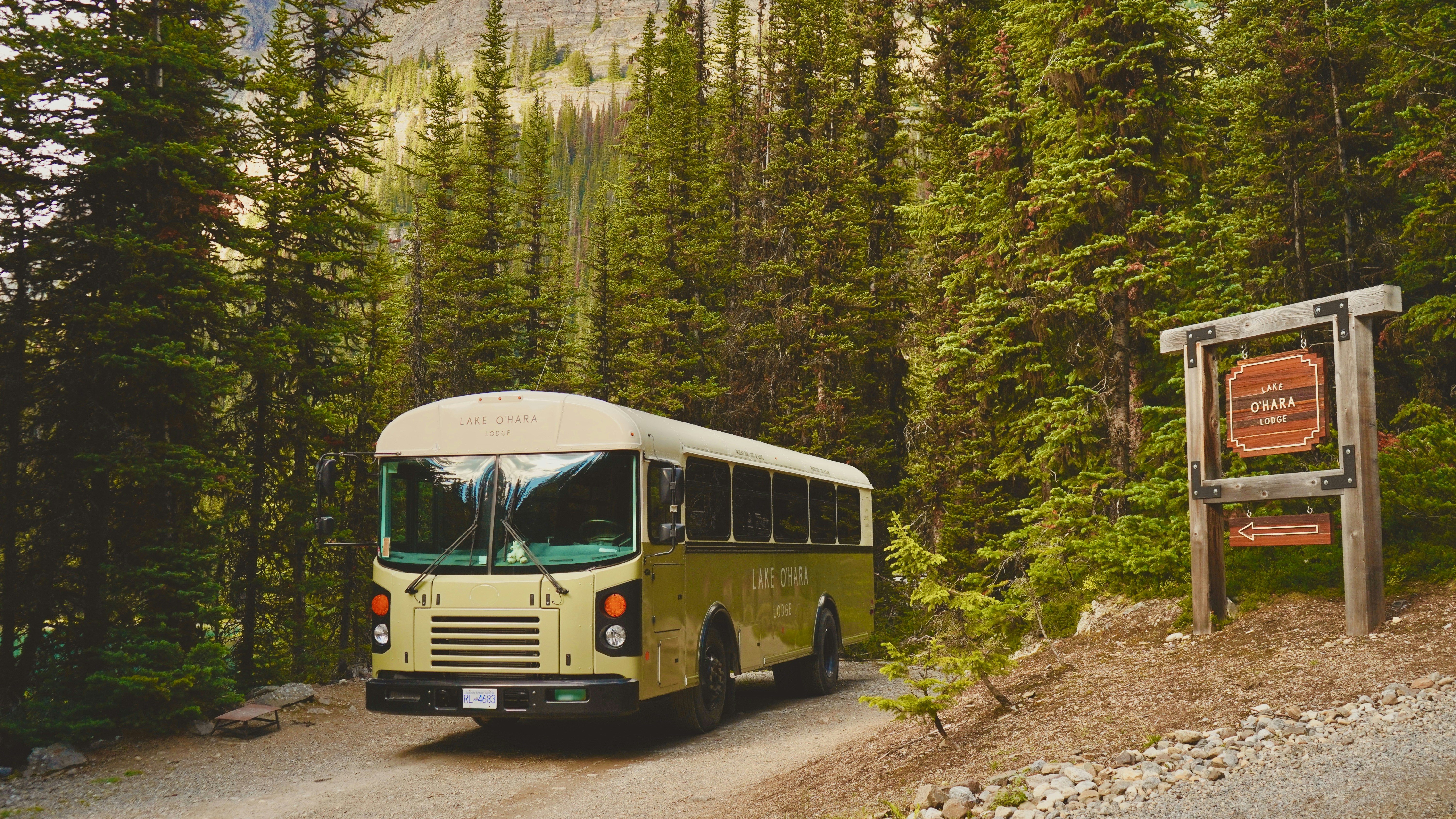 A luxury charter bus parked near a scenic location