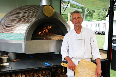 Chef with pizza oven and peel