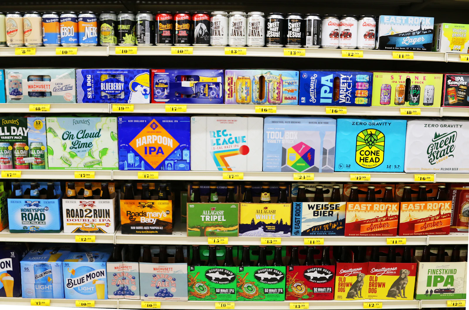 Store shelves stocked with a variety of beer and other drinks