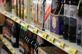 Bottles and boxes of beverages on a store shelf