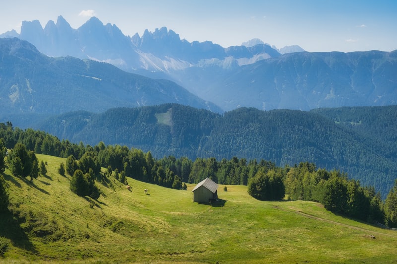 Alpine houses below mountains on a sunny day in South Tyrol