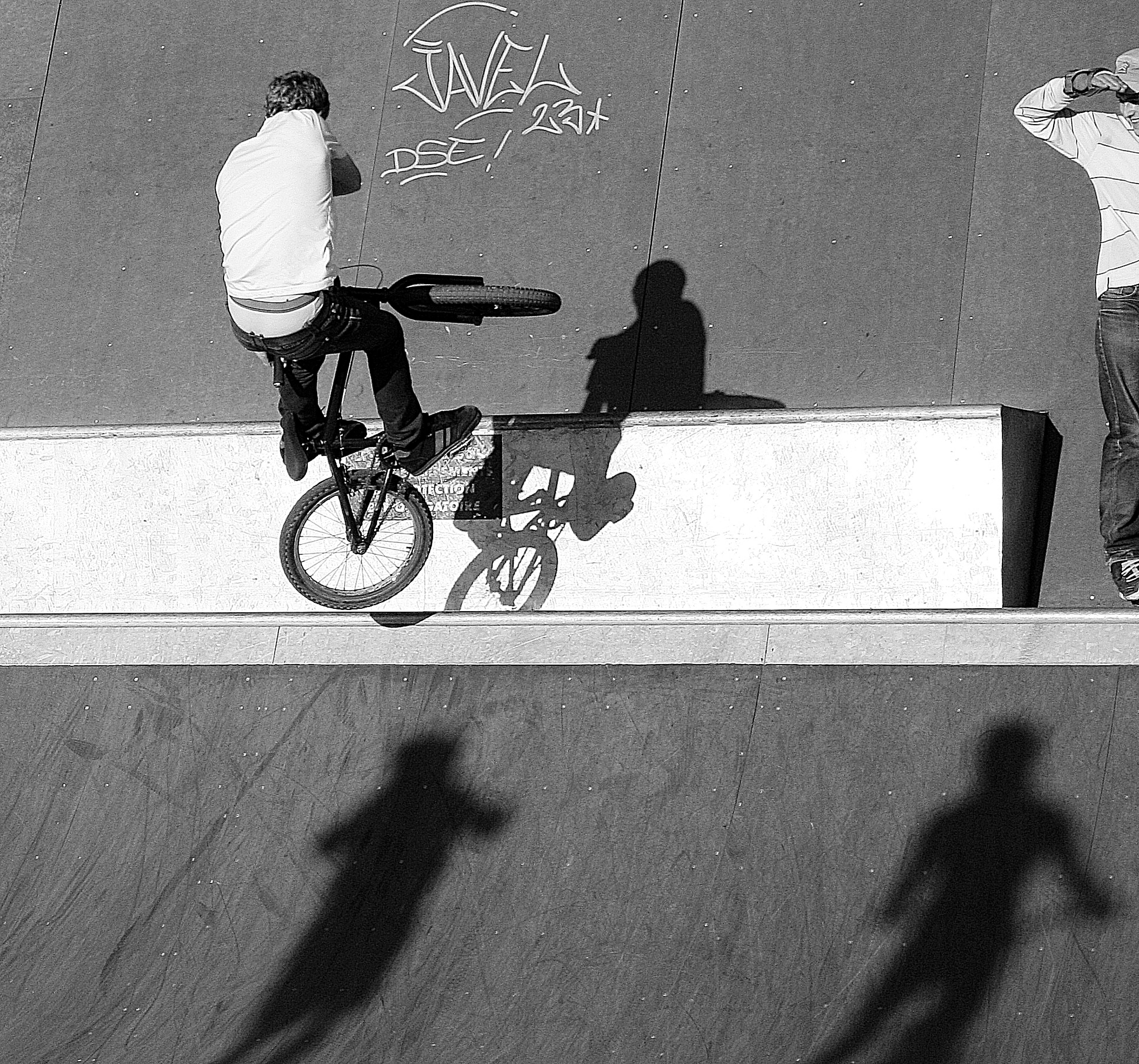 Bmx rider performs a trick at a skatepark