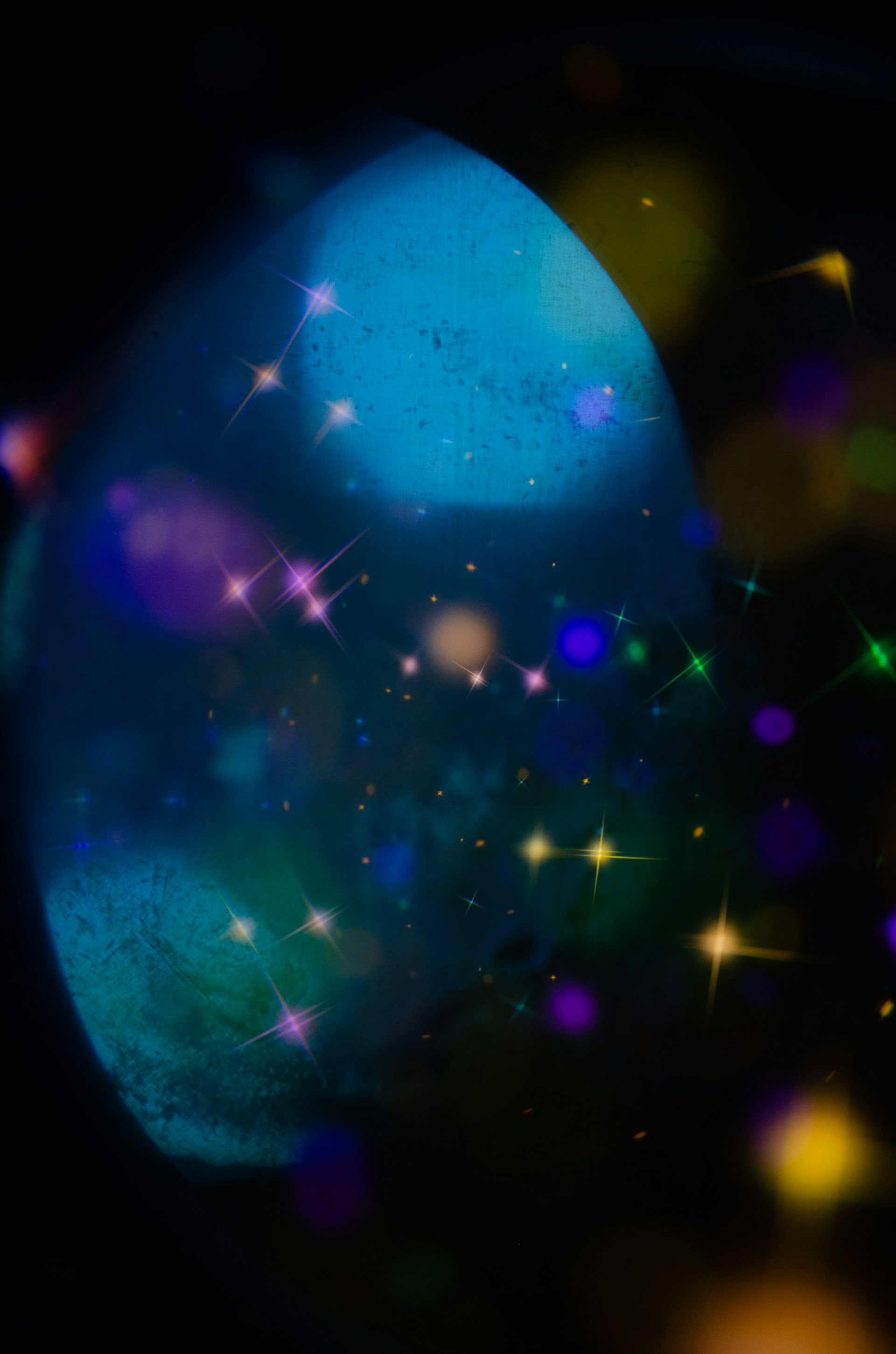 Abstract blue and purple bokeh lights with sparkles