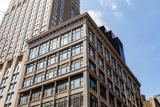 Modern buildings against a bright blue sky.
