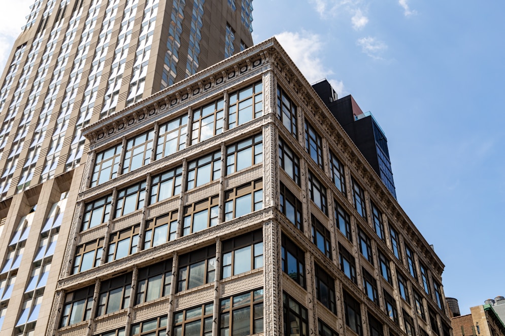 Modern buildings against a bright blue sky.