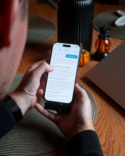 Person holding smartphone with text on screen