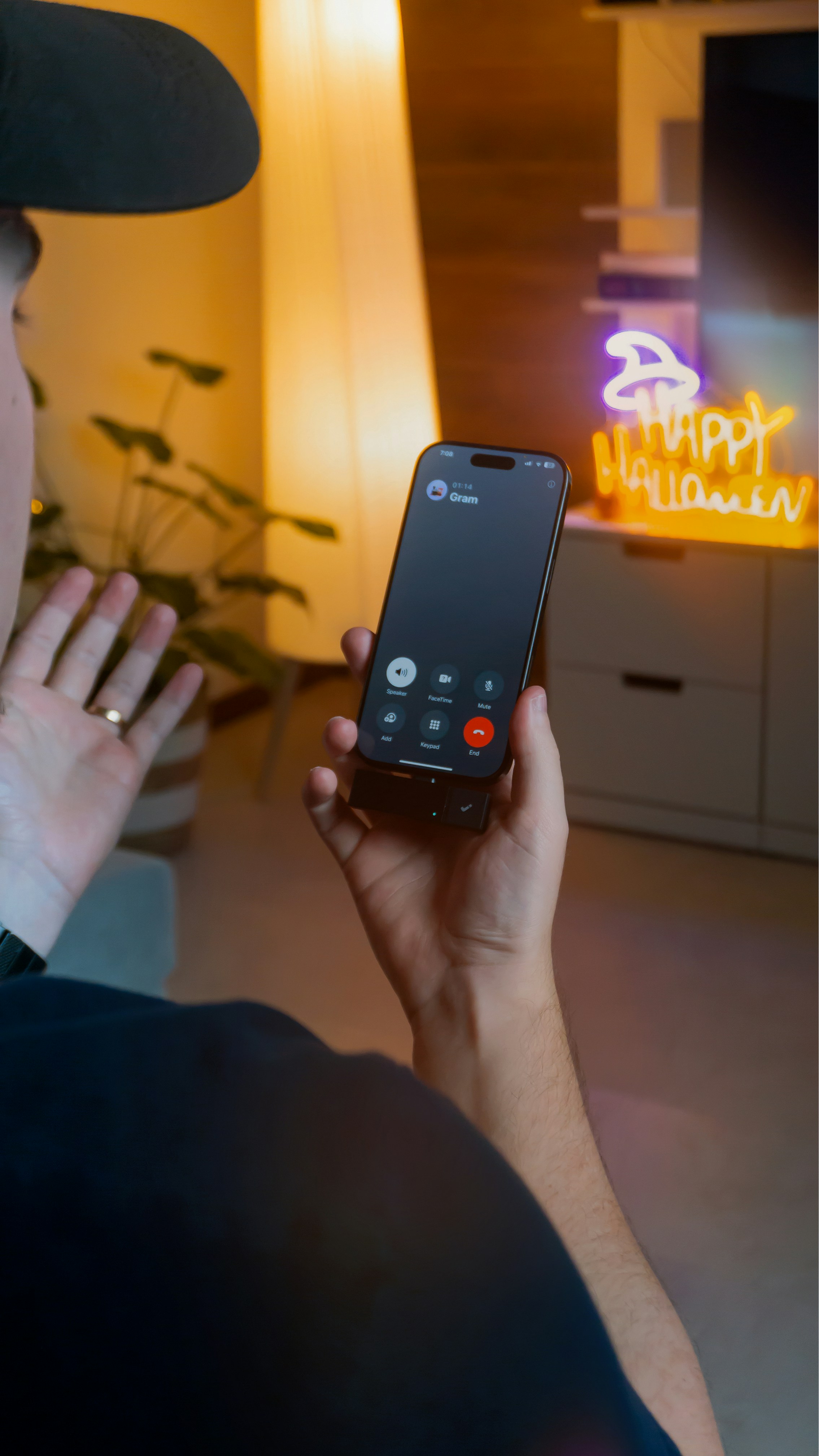 Person on a video call with a halloween decoration.