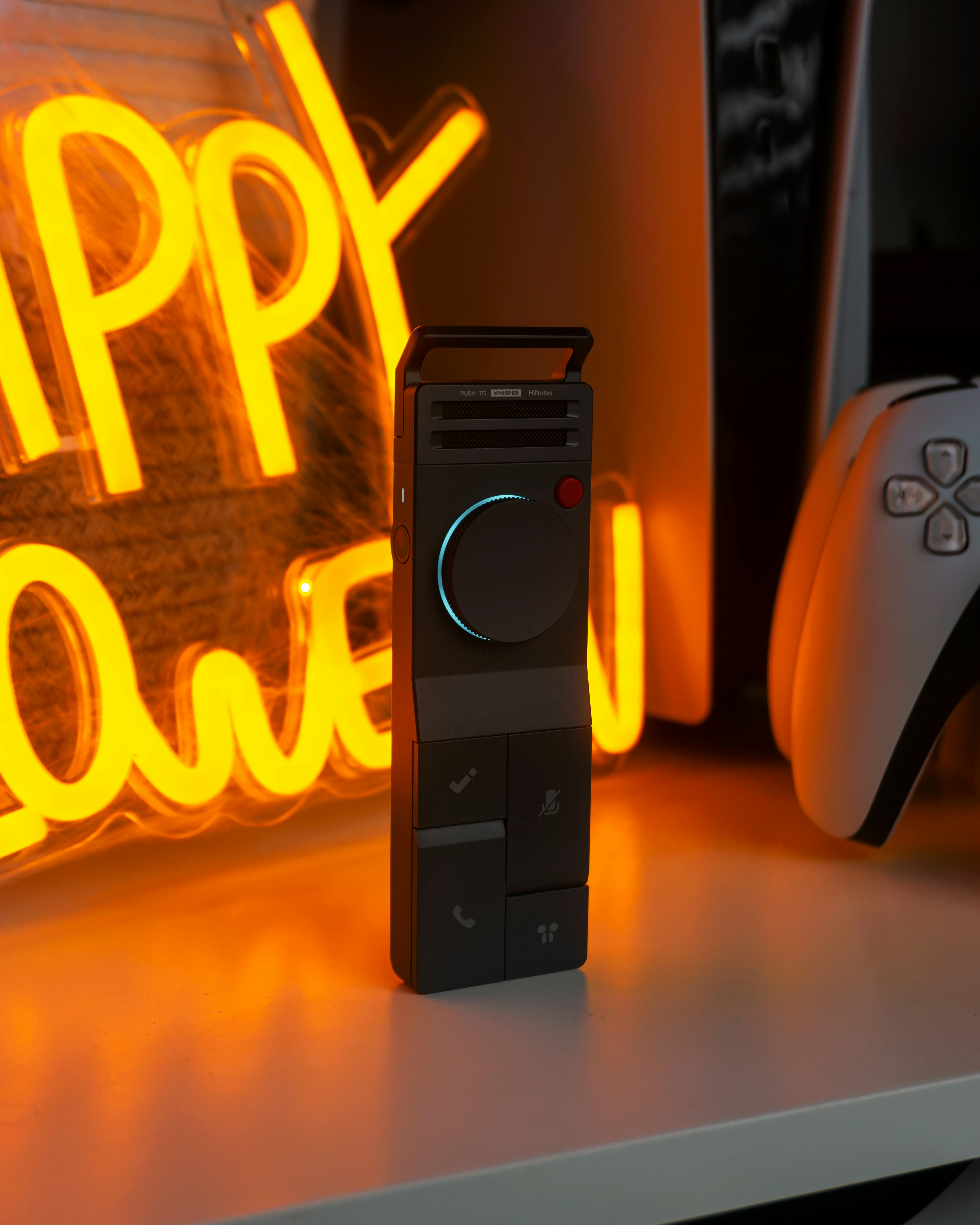 Modern black device with neon orange sign