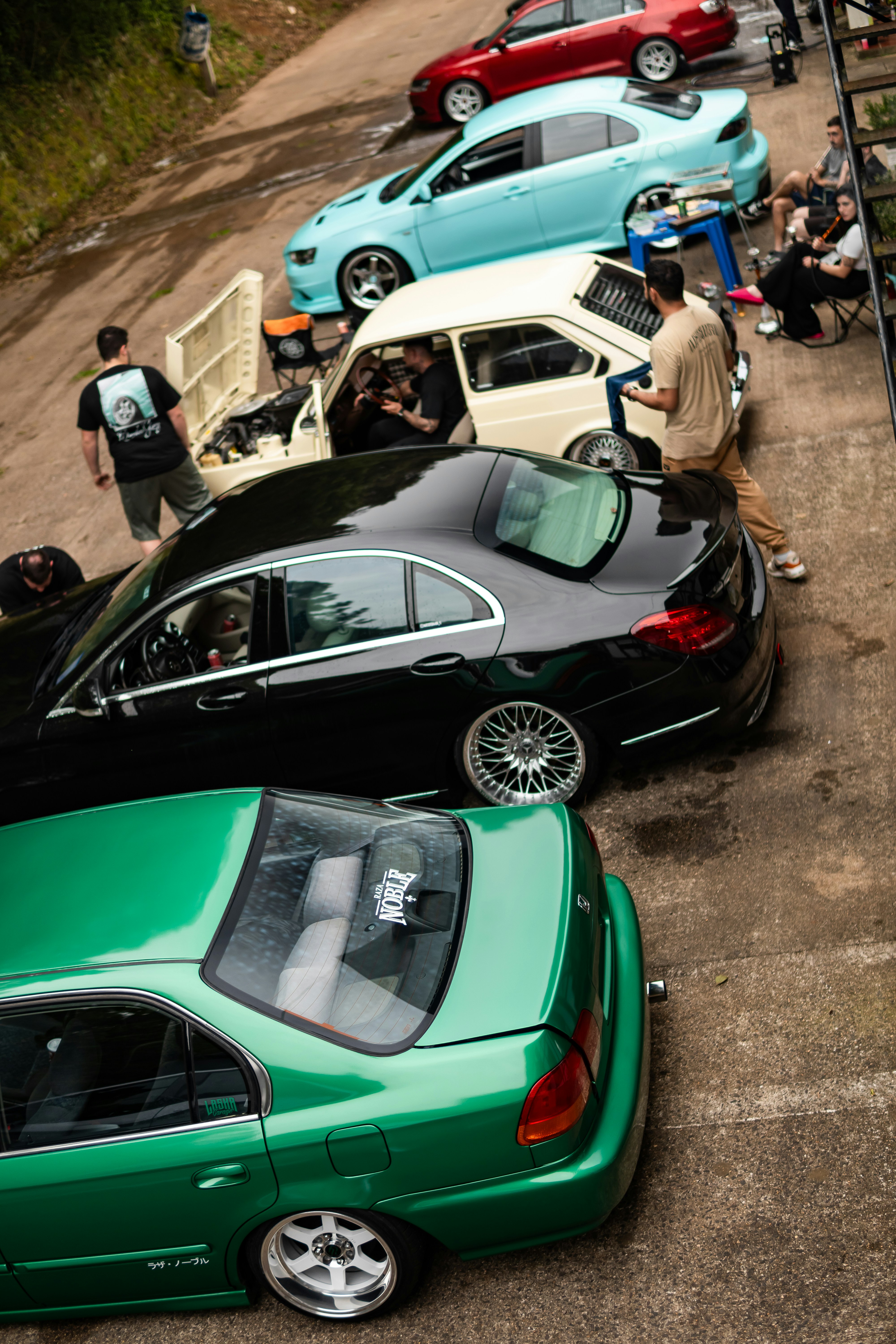 Several cars parked in a row outdoors