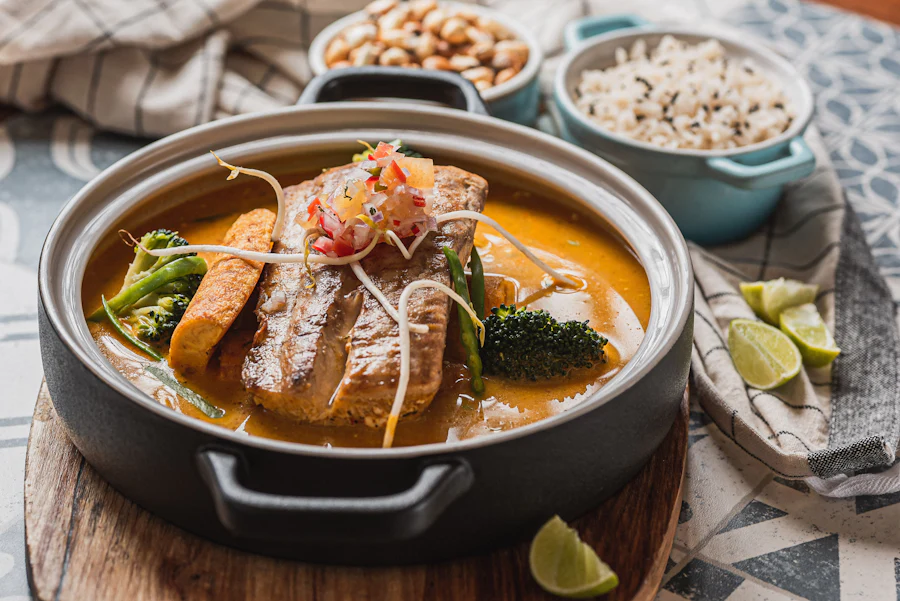 Goan fish curry served with rice, lime and cashews