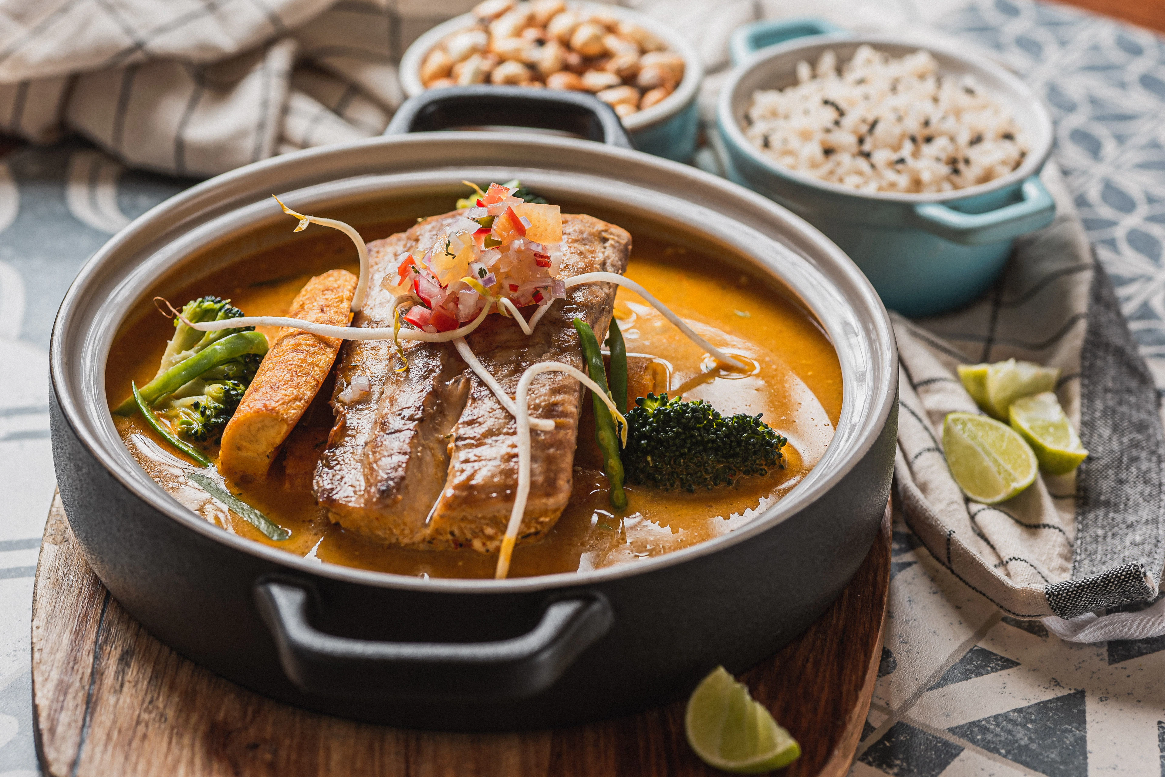 Fish curry served with rice and lime