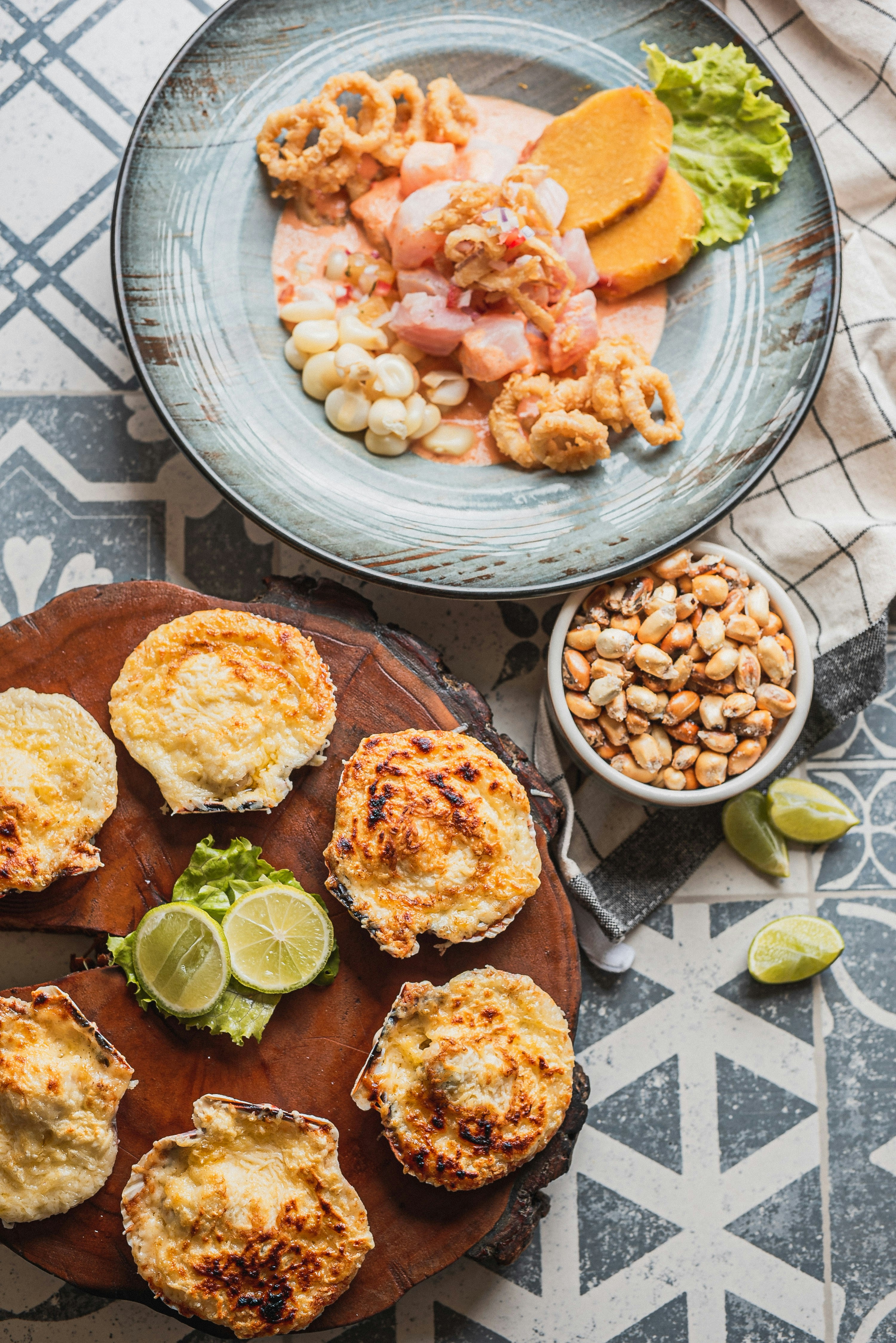 Seafood ceviche with baked scallops and corn