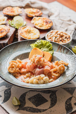 Peruvian ceviche with fried calamari and corn