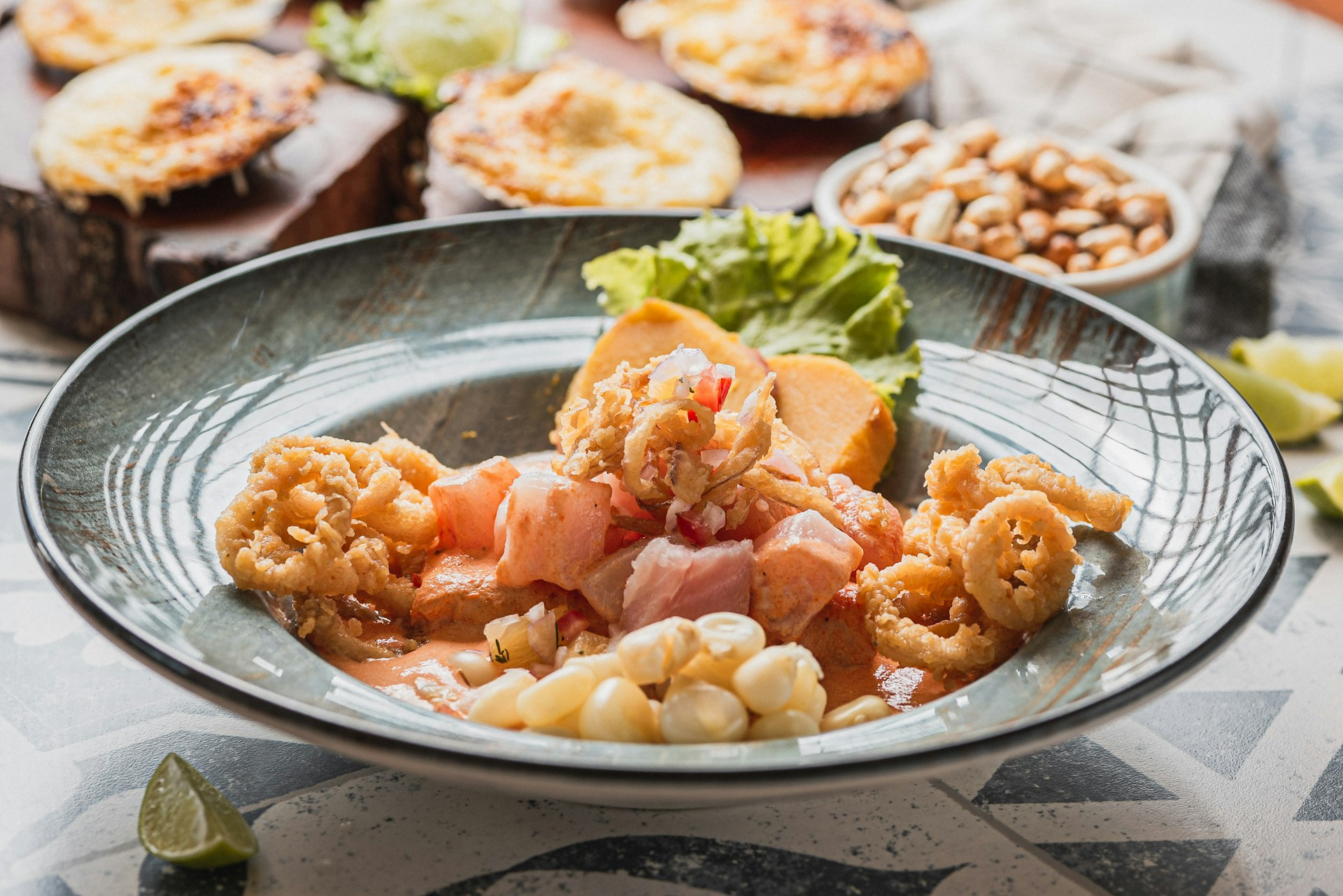 Seafood ceviche with fried calamari and corn