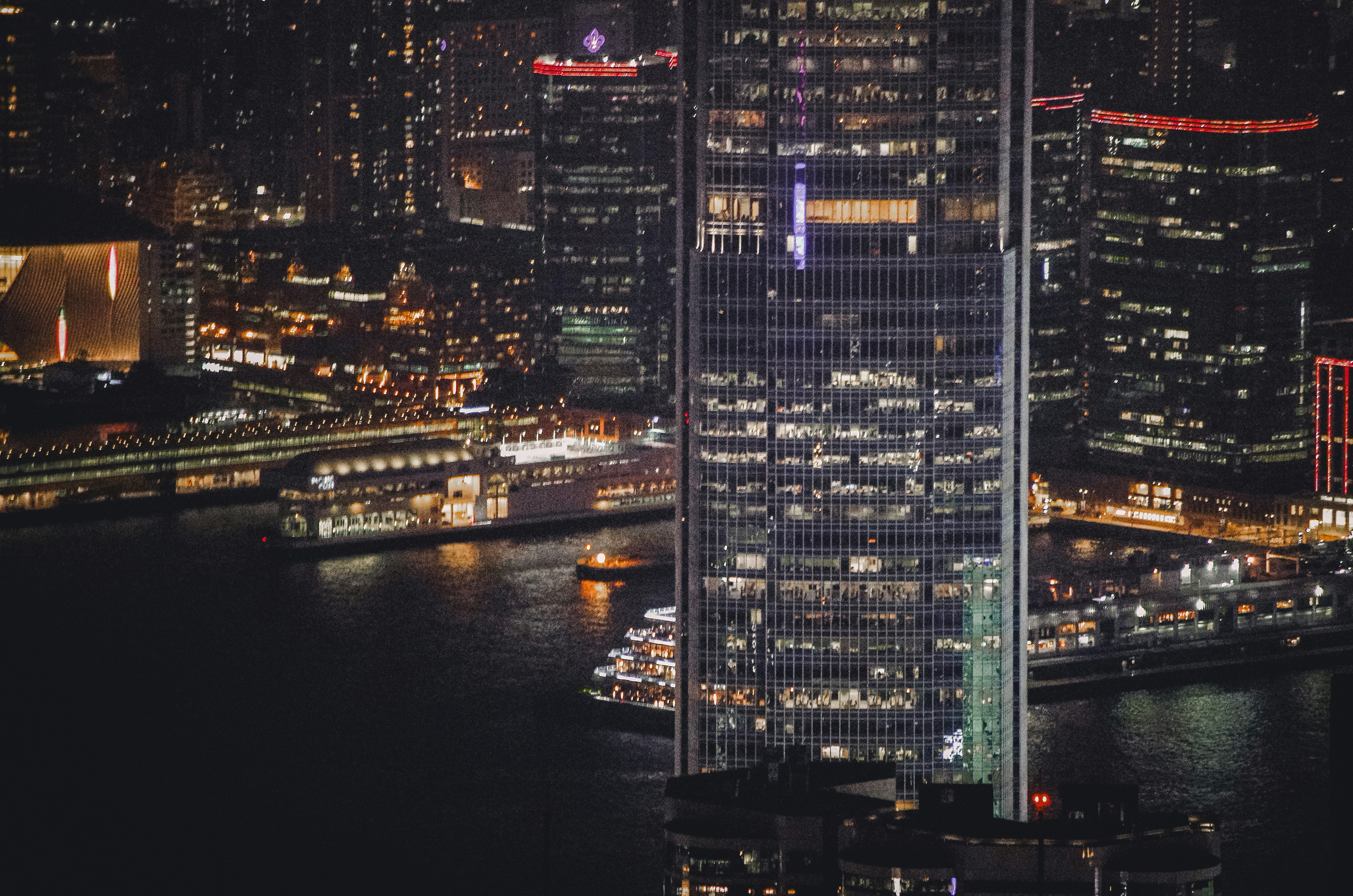 City skyline with illuminated skyscrapers at night