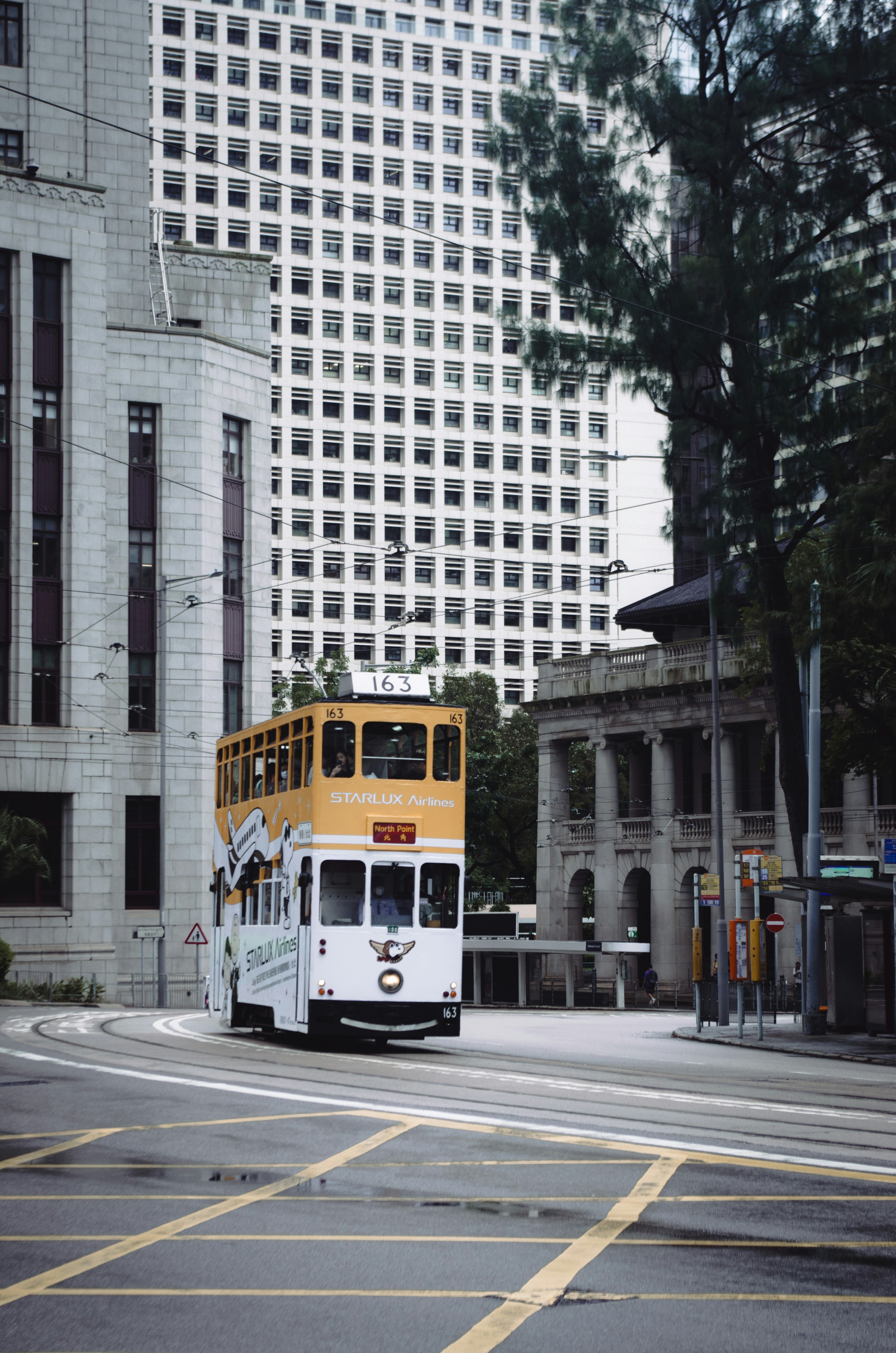 A double-decker tram on a city street.