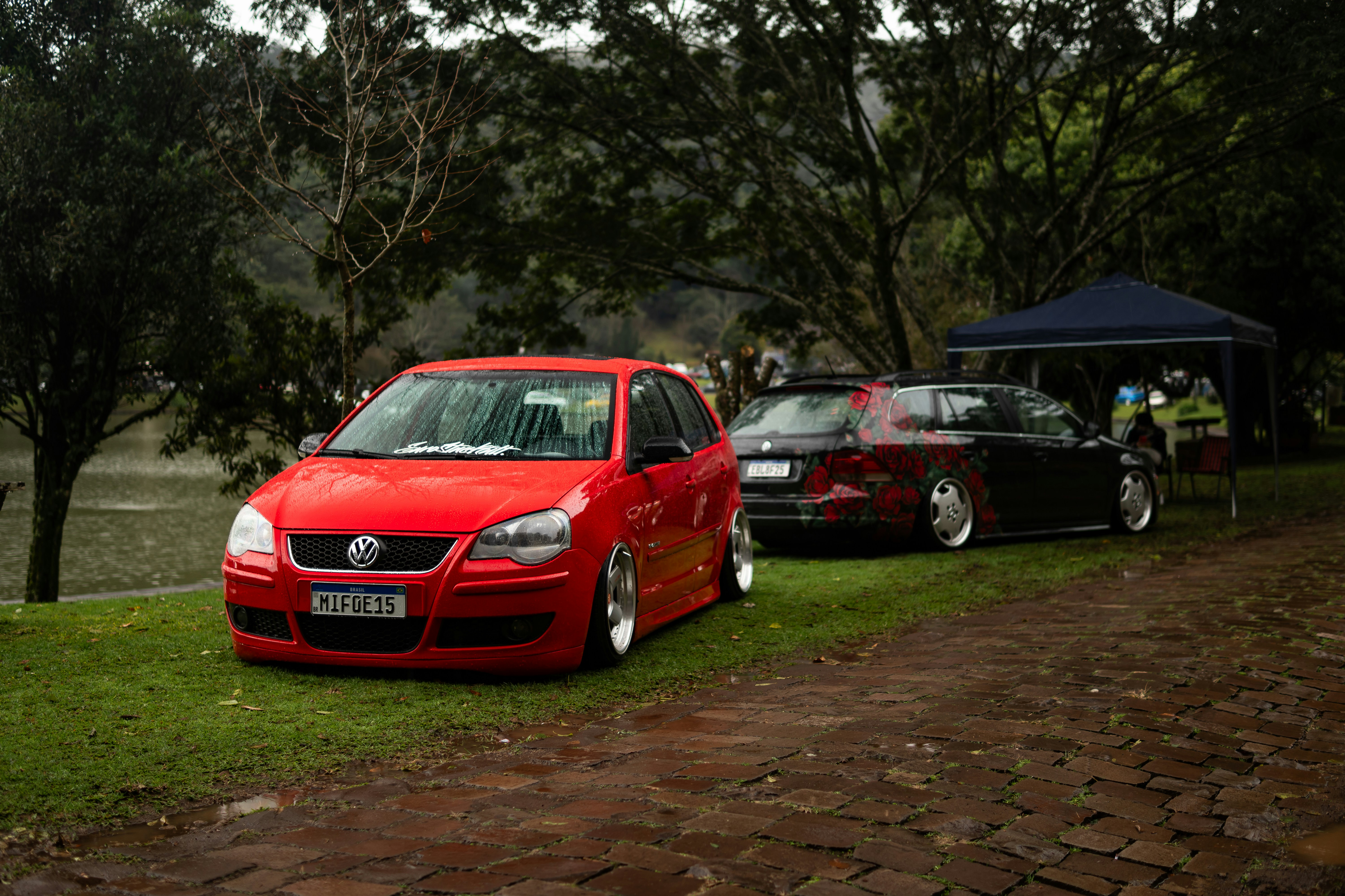 Two modified cars parked near a lake photo – Free Stance car Image on ...