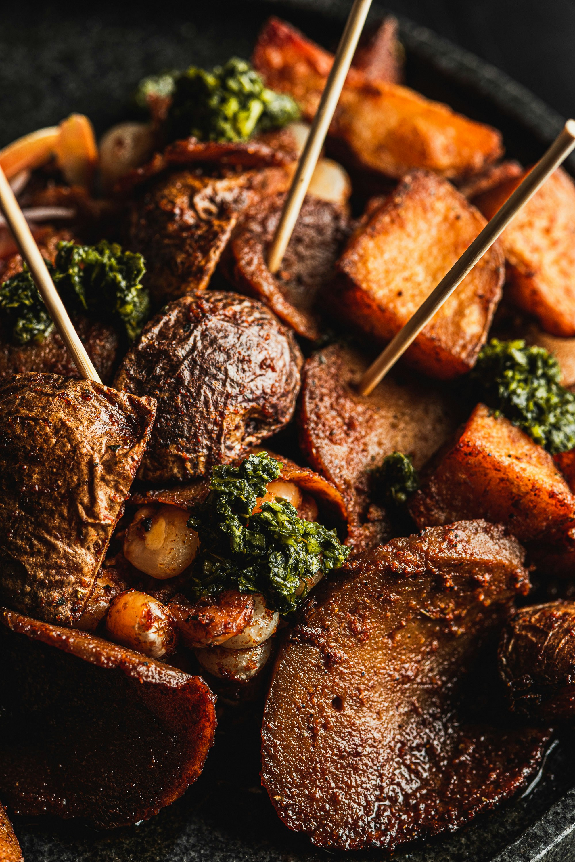 Roasted root vegetables with herbs and toothpicks