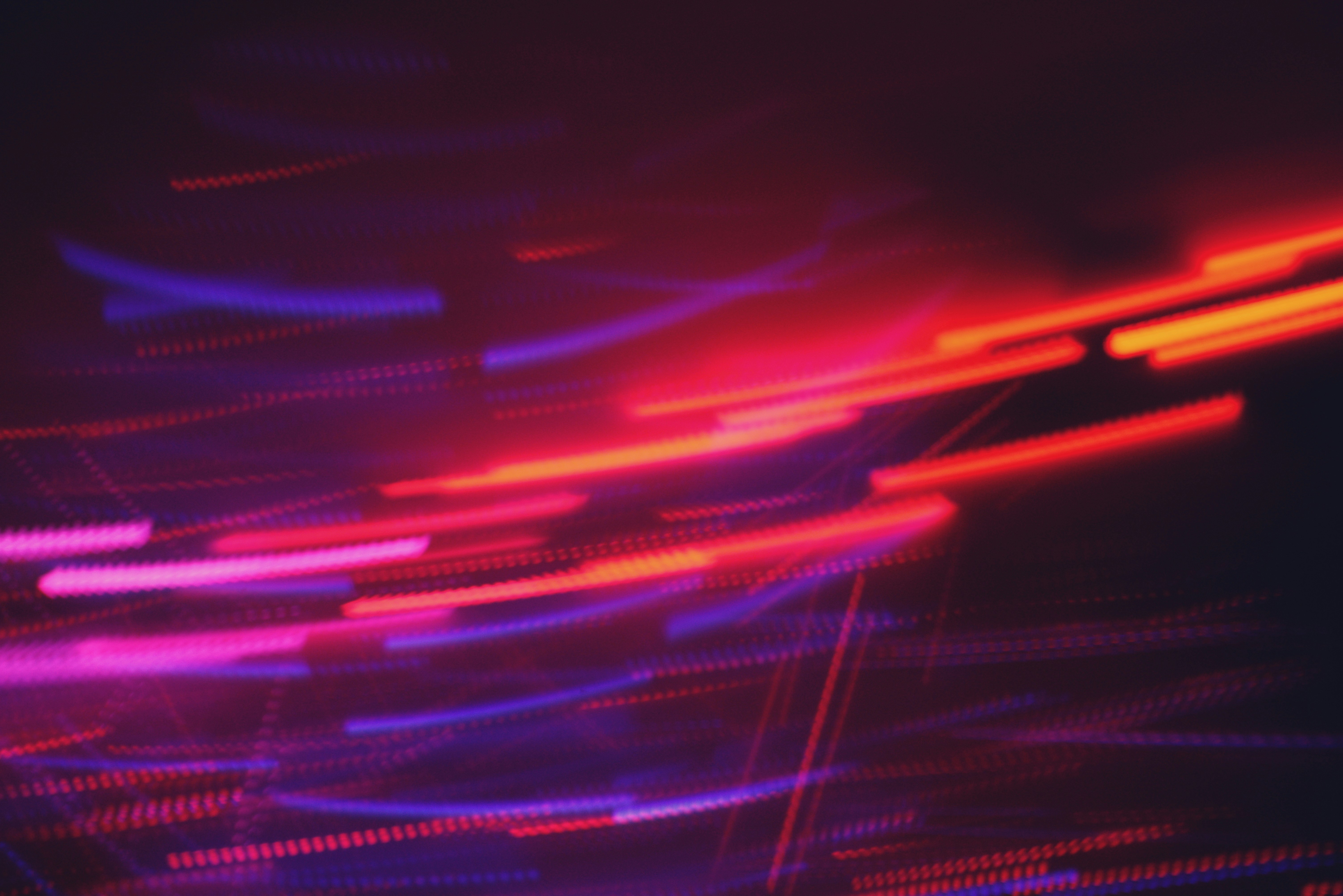 Abstract streaks of red and purple light