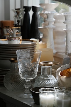 Collection of decorative vases, glasses, and candles