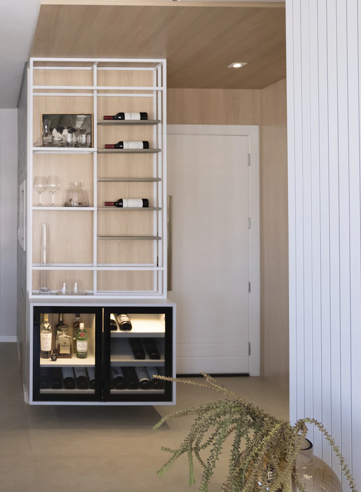Modern wine cabinet with bottles and glassware